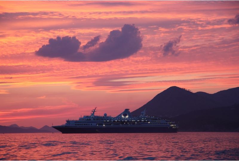 Ship at sea with the midnight sun