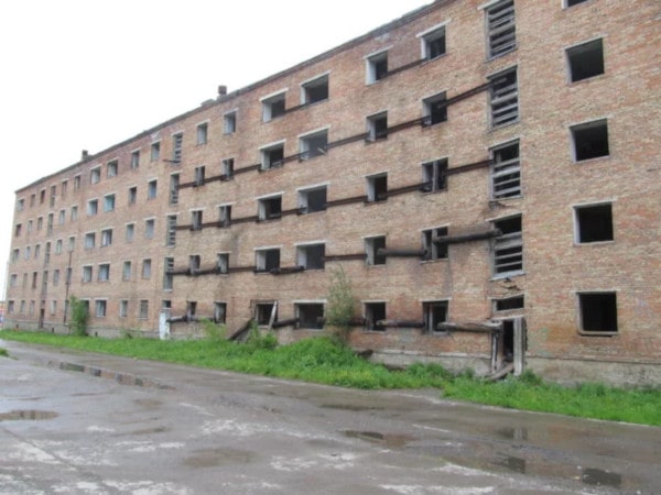 An apartment building in Russia sinks as permafrost thaws. (Dmitry Streletskiy)