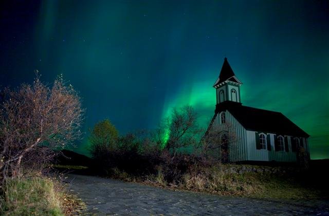 Church bathed in Northern lights